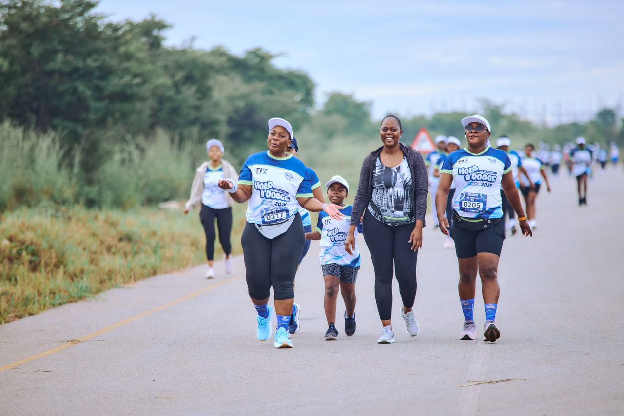Runners walking and celebrating together during a community race